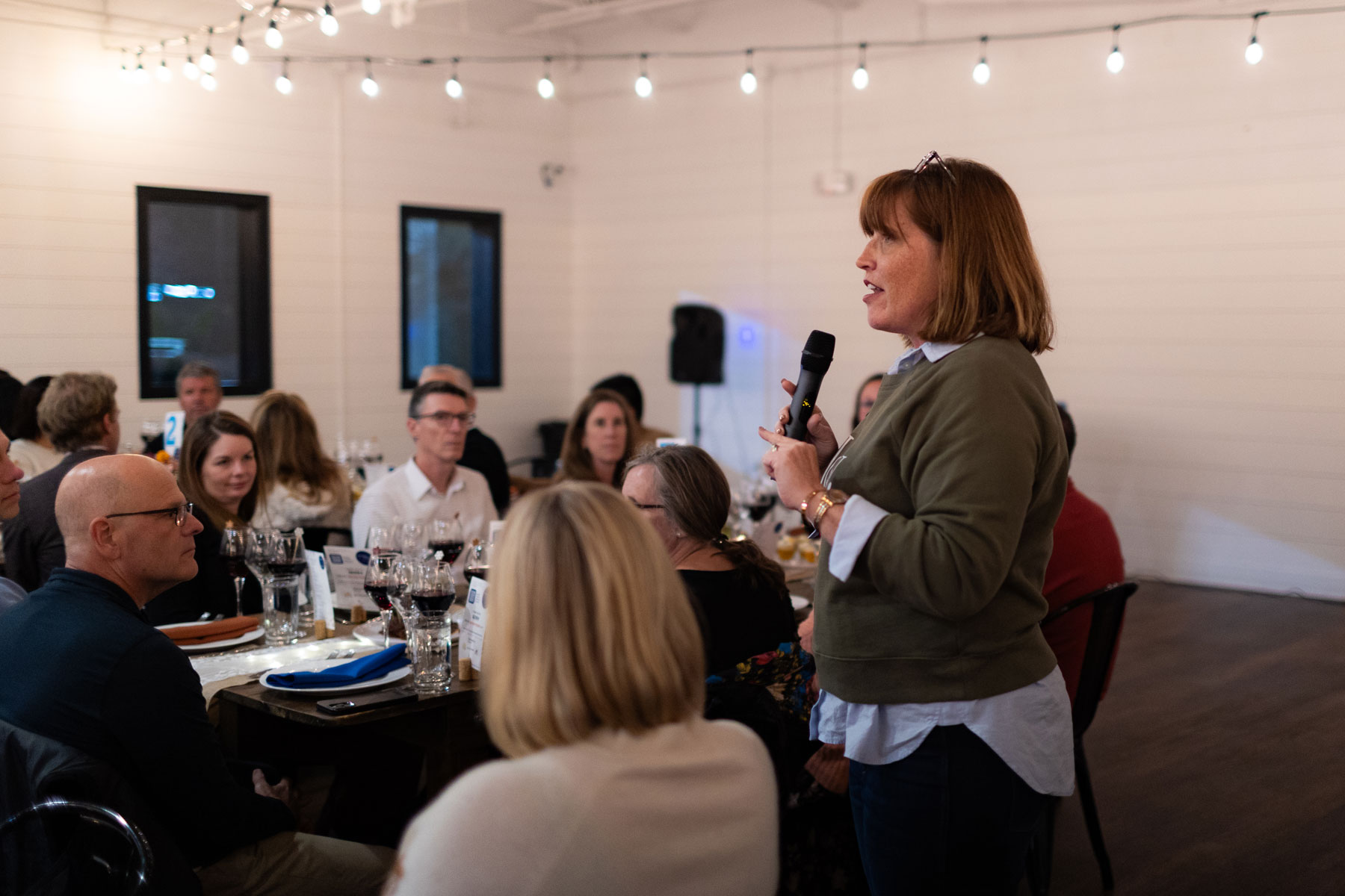 President & CEO Maggie Stevens speaking to attendees at Taste of Thanks